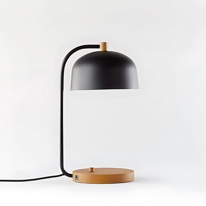 The Ledger Desk Lamp blends metal and wood includes USB port for convenient device charging anywhere.