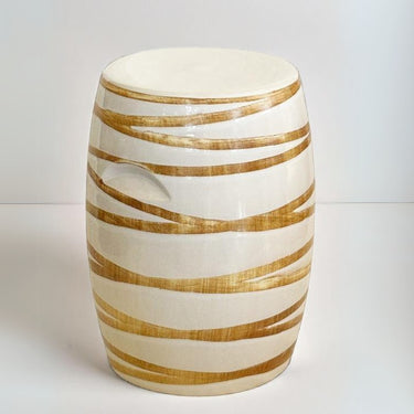 High-quality ceramic stool, perfect for outdoor patios, poolside, or indoor spaces, with sleek design and gold-like accents. Available online at Woodka Interiors South Africa.