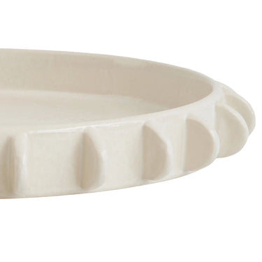 Close-up detail of the ridged edfe on the Lunaria large ivory white ceramic tray.