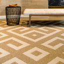 Mandla Sand Rug styledwith a black woven side table, and wooden bench.