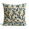 Scatter Cushion in mint green background with a bold, block-print pattern of deep navy leaves and marigold yellow flowers.