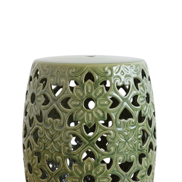  High-gloss green ceramic stool with a pierced floral medallion lattice and flat circular top. Chinoiserie accent table or a sculptural outdoor patio seat, close-up.