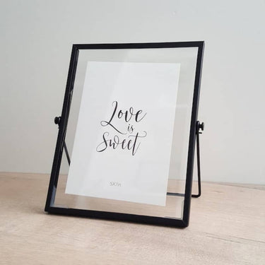 Black metal picture frame with a sleek, modern design