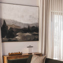 Extra large framed horizontal canvas art of a moody misty mountain landscape with forest green and beige impasto brushstrokes for living room decor.