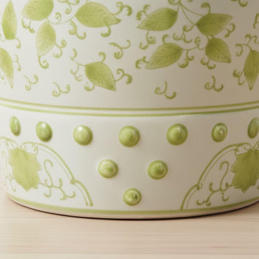 Ming Ceramic Stool showing the raised stud detailing and green leaf pattern