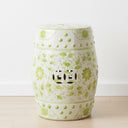 Decorative ceramic stool with green floral patterns and luck coin cut out design from Woodka Interiors