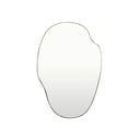 An organic-shaped wall mirror with a brass metal frame, shown against a plain white background.