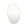 An organic-shaped wall mirror with a brass metal frame, shown against a plain white background.