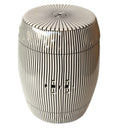 sunburst pattern top and drainage hole on a monochrome black and white pinstipe ceramic stool.
