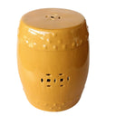 Saffron drum-shaped, mustard ceramic garden stool glazed and cutout geometric motifs