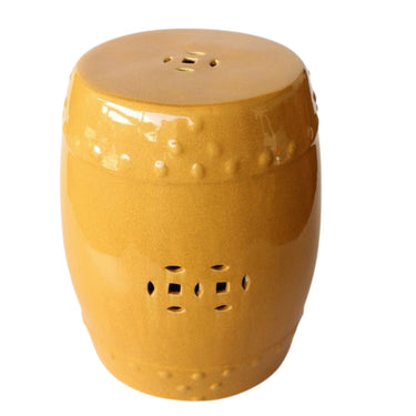 Saffron drum-shaped, mustard ceramic garden stool glazed and cutout geometric motifs