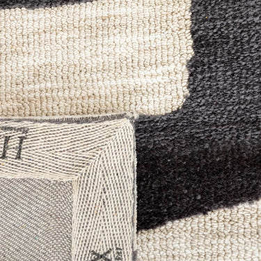 Close-up of the plush polyester texture of Mystery Rug in slate
