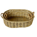 Nesting oval rattan baskets in three sizes for versatile storage.