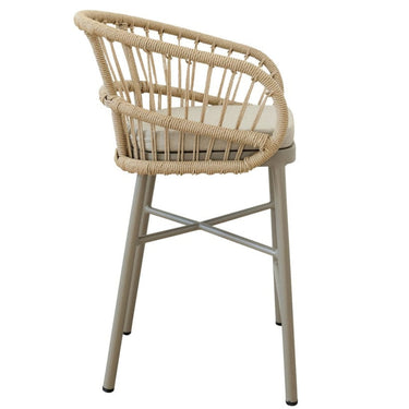 Stackable Lola counter stool with rattan finish and cushioned seats, ideal for patio or kitchen seating.