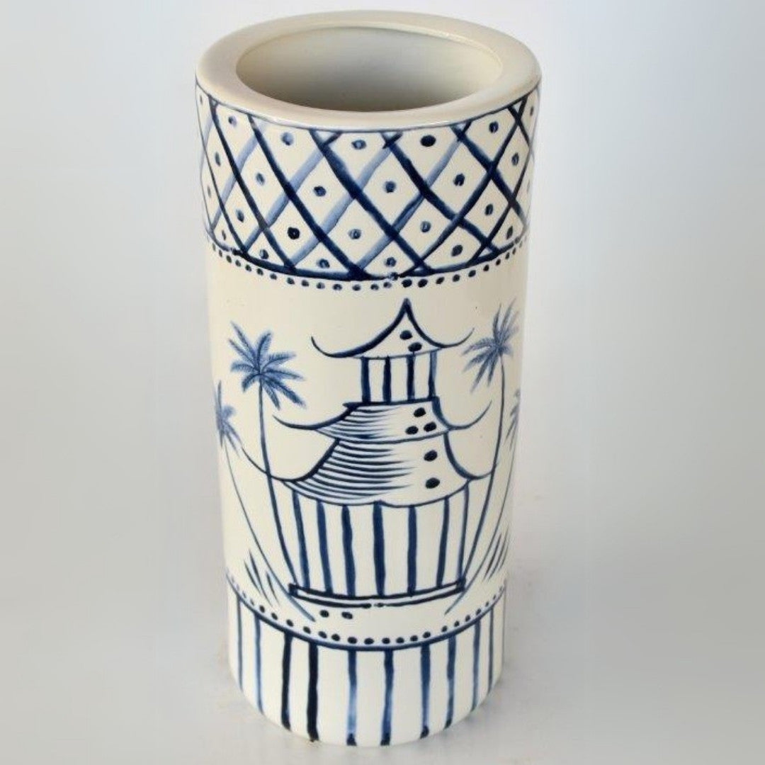 Ceramic umbrella stand with a timeless blue pagoda pattern for entryway decor.