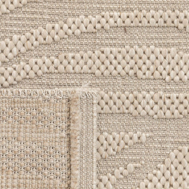Close-up view of the stain-resistant polypropylene fibre weave on a leaf pattern outdoor rug.