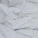 Polar faux fur throw close-up the textured white blanket