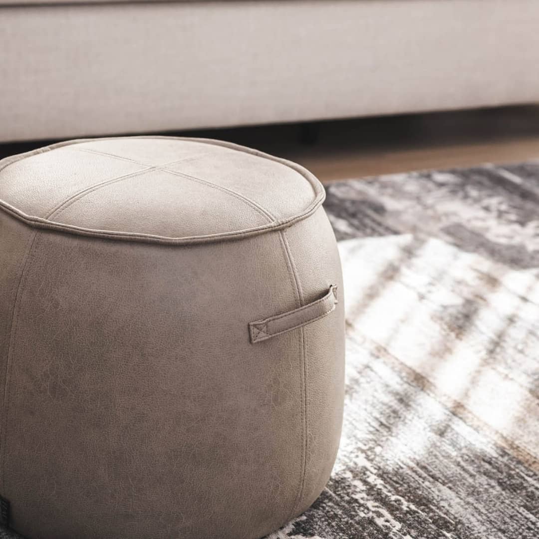 Boulder Stool in living room setting by woodka Interiors