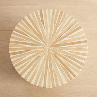 top of a side table with a sunburst design and a mother of pearl finish 