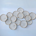 Stylish white and gold circles on a white surface, embodying a serene and luxurious aesthetic for modern interior spaces