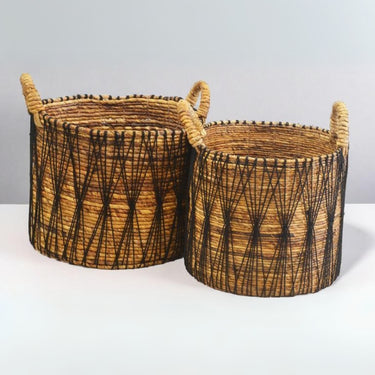 Handwoven Raven decorative baskets with black cotton detailing for stylish storage.