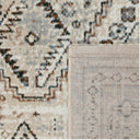 Texture detail of the Remnant Rug in Vintage showing the distressed cream and charcoal recycled polyester fibers.