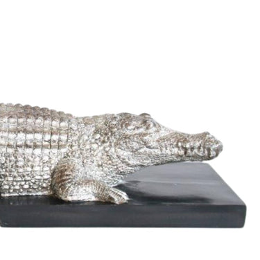 Resin crocodile bookends in silver, perfect for adding unique style to bookshelves.