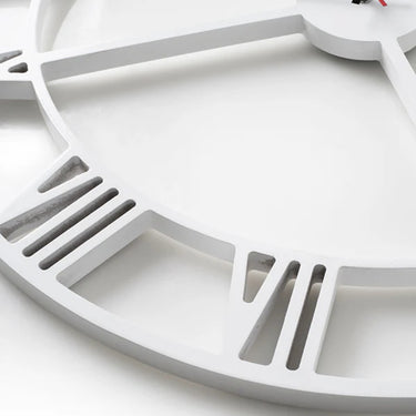 Modern Roman Numeral Clock with white finish and cut-out design. Available online at Woodka Interiors South Africa.