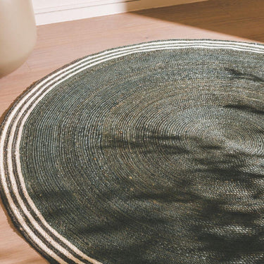 French Riviera Round Rug styled  on a living room floor 