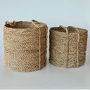 Round seagrass baskets in two sizes for versatile décor.