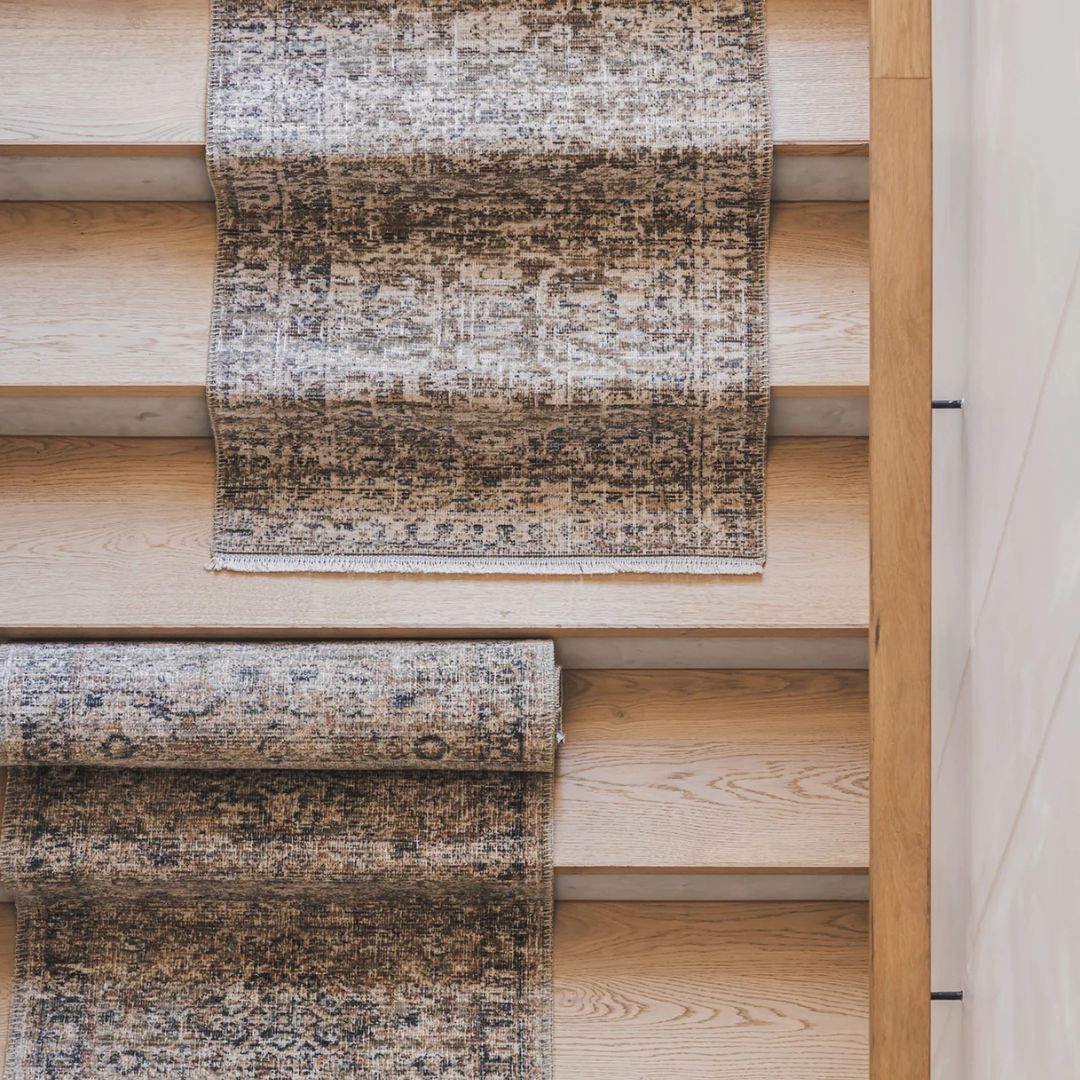 Tradition Royal Runner Rug features a narrow shape with a distressed, vintage-style design in muted blue, beige, and tan.