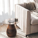 Sculpted Side Table in Husk on a area rug in a living room