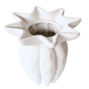 White fluted ceramic vase with matte finish
