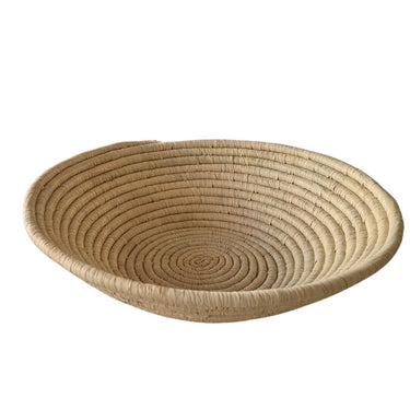 woven bowl handcrafted by artisans using natural sisal and sweetgrass.