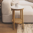 Modern living room side table with white honed marble top and natural cane tier