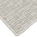 Flat-woven rug inspired by nature’s detail, perfect for luxury decor in both indoor and outdoor settings.