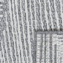 Close-up of polypropylene weave on a Tangram reversible geometric outdoor rug in smoke option