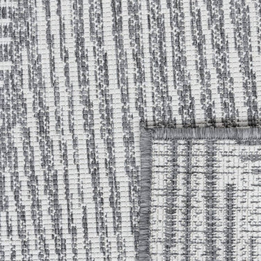Close-up of polypropylene weave on a Tangram reversible geometric outdoor rug in smoke option
