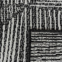 Close-up of polypropylene weave on a Tangram reversible geometric outdoor rug in inkwell option