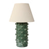 Table lamp with textured green base and beige lampshade