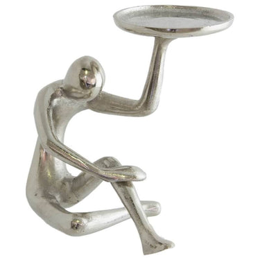 Thinker Candle Holder made from raw silver metal with abstract figure design