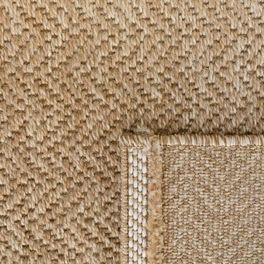 Stylish Torra Dune Rug, a neutral-toned outdoor rug suitable for any setting, available online at Woodka Interiors South Africa.