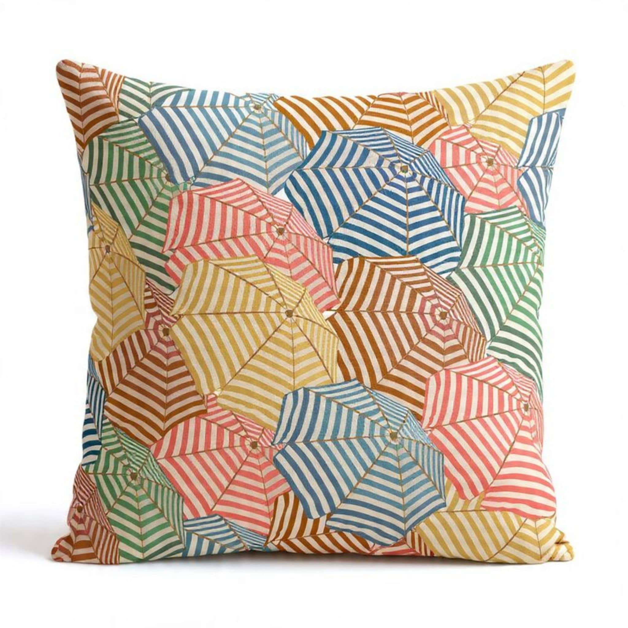 Scatter cushion with a colourful retro pattern of overlapping striped beach umbrellas 