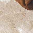 Close-up of a plush Vagabond geometric area rug in the light beige Drift, featuring a soft oatmeal texture with faint, cream-coloured diamond lines