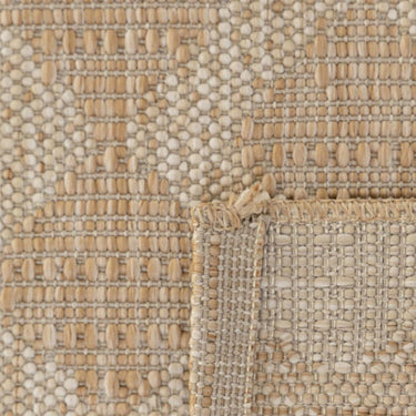 Close-up of a polypropylene patio rug with a beach geometric trellis pattern from the Vava'u Outdoor Rug collection.
