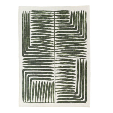 Vertigo Rug in Jungle with green and natural tones in a botanical-geometric pattern.