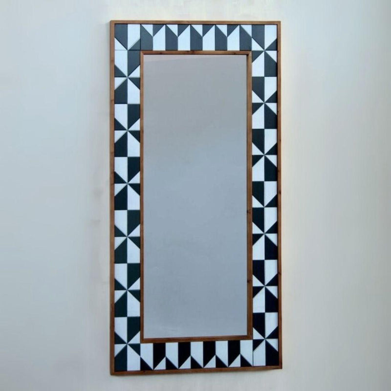 Rectangular wall mirror with a geometric frame.