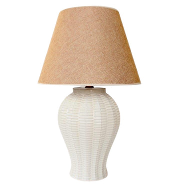 Textured table lamp with ceramic weave base and beige shade.