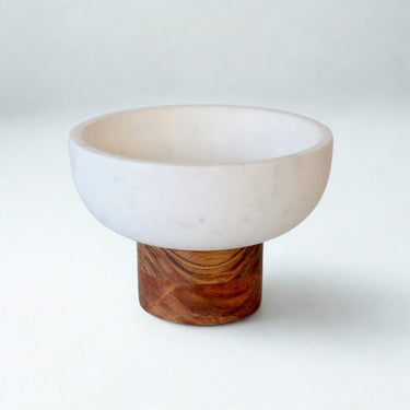 Best view of marble and wood bowl styled on counter 