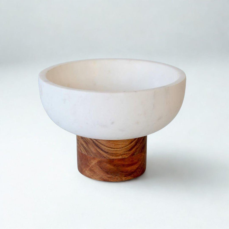 Best view of marble and wood bowl styled on counter 